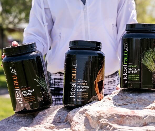 3 tubs of IdealRaw in a line on a rock
