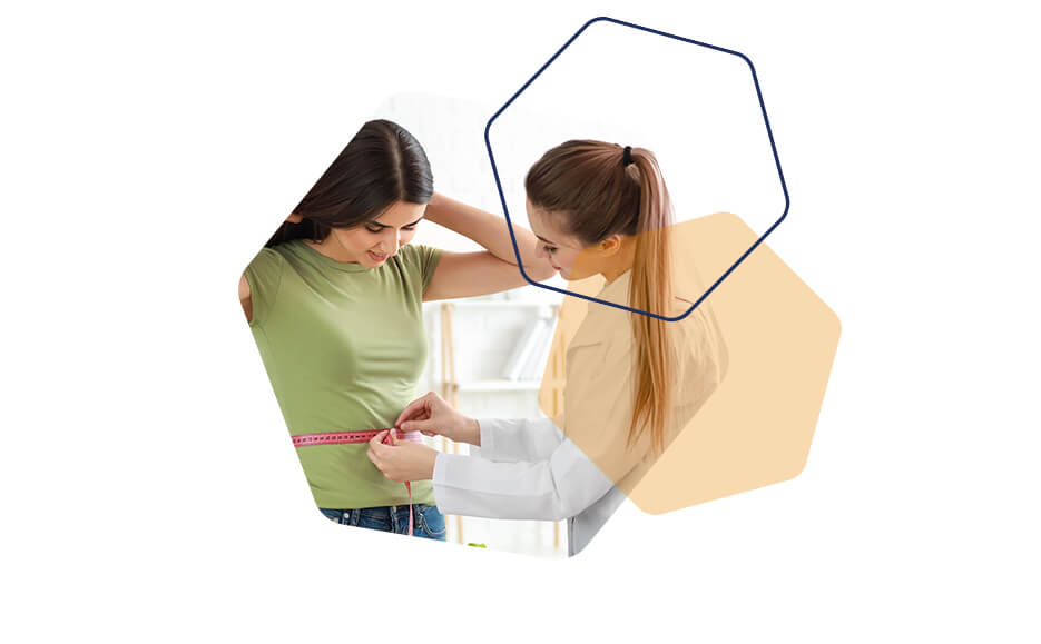 Image of a woman measuring another woman's waist with a tape measure