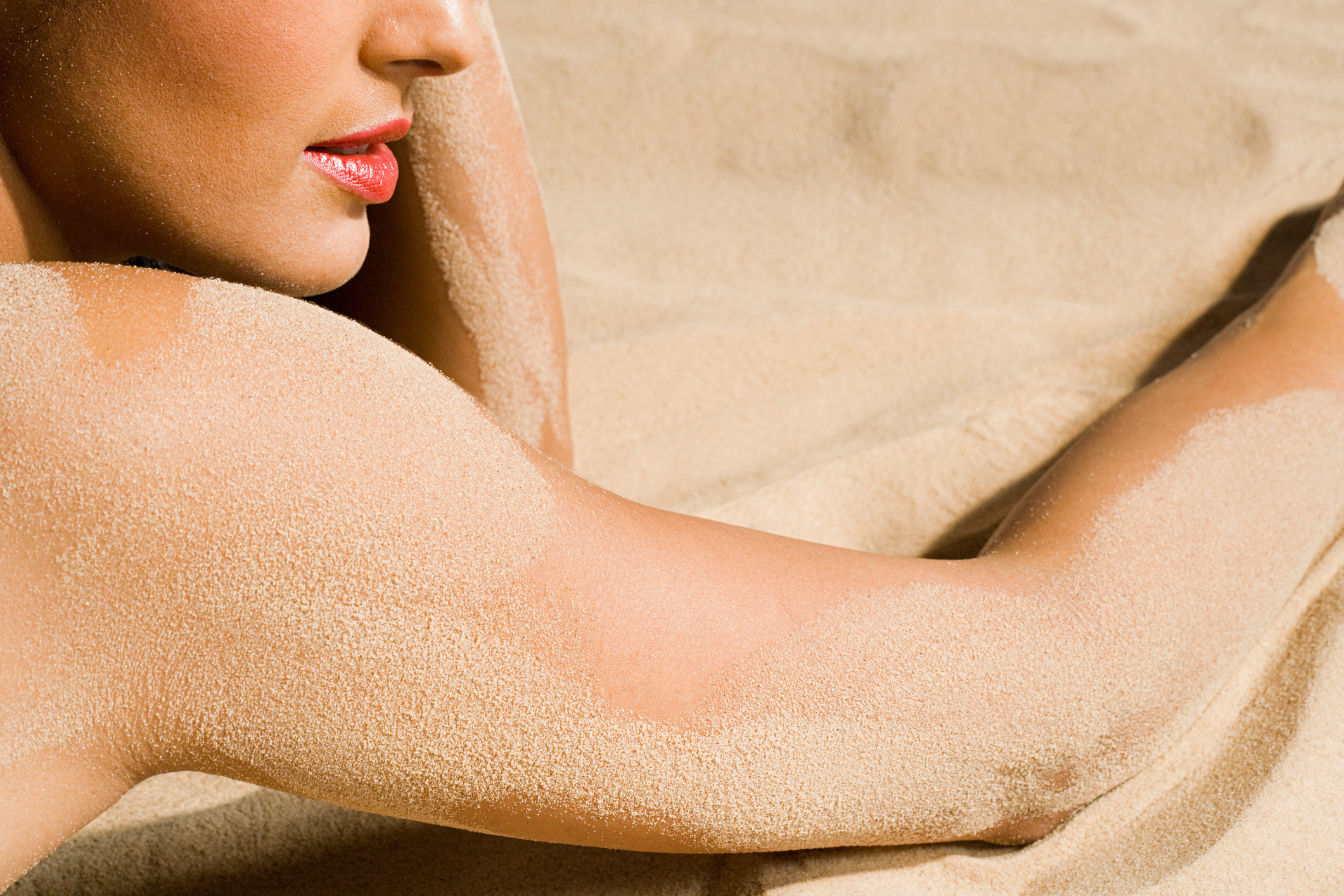 Woman lying in the sand